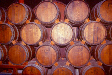wine casks stacked for aging